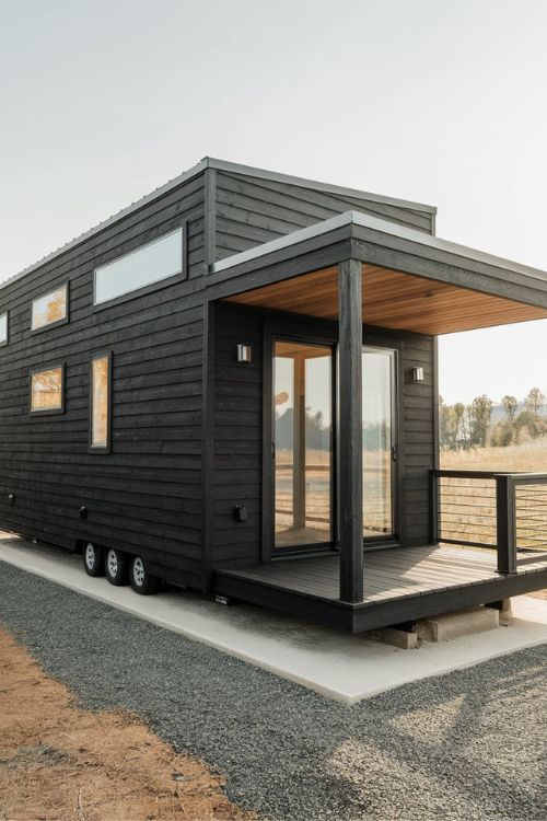 Black Indoor-Outdoor Design Tiny House Exterior Designs You Need to See Modern Minimalism Meets Nature